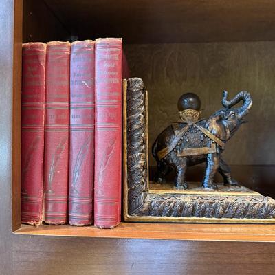 Pair of elephant book ends with books