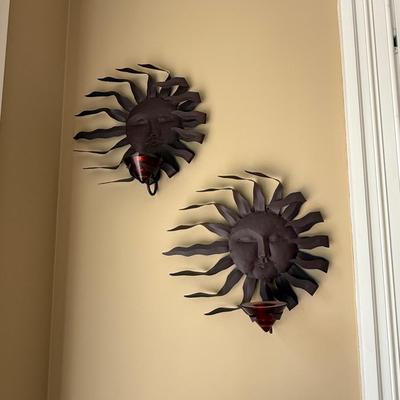 Two metal sun candle holders