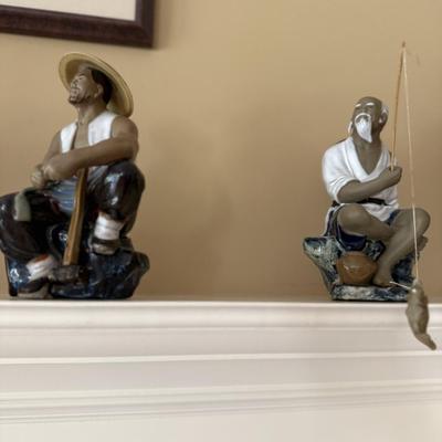 Four Asian figures and elephant