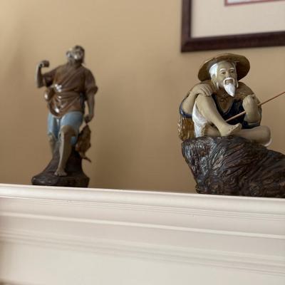 Four Asian figures and elephant