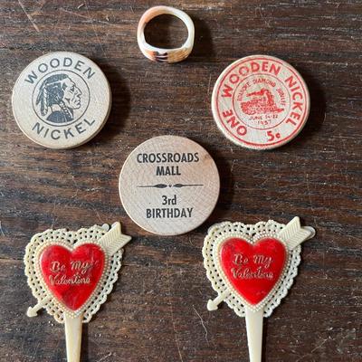 Sale Photo Thumbnail #16: 2 Crossroads mall wooden nickels
1 Diamond Jubilee Roanoke wooden nickel
A vintage ring and 2 vintage valentines cake decorations