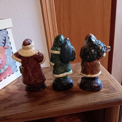 3 CAST IRON DEPARTMENT 56 SANTAS AND A GIFT BOX