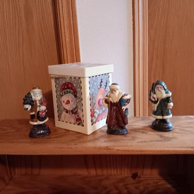 3 CAST IRON DEPARTMENT 56 SANTAS AND A GIFT BOX