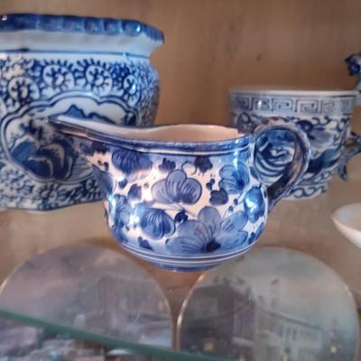 BLUE AND WHITE PLANTERS AND DISHES