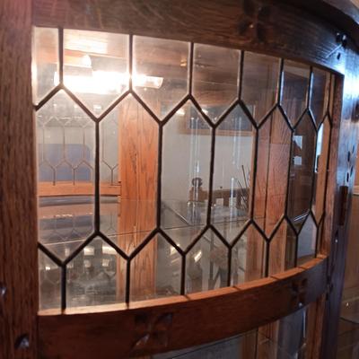 VERY NICE LIGHTED CURIO CABINET WITH LEADED GLASS (TOP FRONT), CARVED WOOD AND LION PAWS