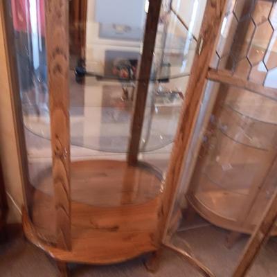 VERY NICE LIGHTED CURIO CABINET WITH LEADED GLASS (TOP FRONT), CARVED WOOD AND LION PAWS
