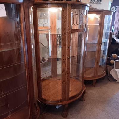 VERY NICE LIGHTED CURIO CABINET WITH LEADED GLASS (TOP FRONT), CARVED WOOD AND LION PAWS