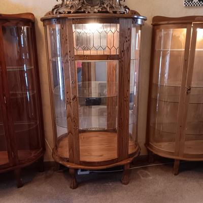VERY NICE LIGHTED CURIO CABINET WITH LEADED GLASS (TOP FRONT), CARVED WOOD AND LION PAWS