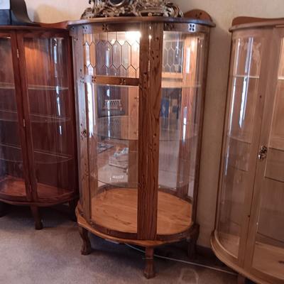 VERY NICE LIGHTED CURIO CABINET WITH LEADED GLASS (TOP FRONT), CARVED WOOD AND LION PAWS