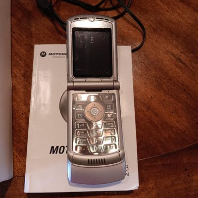 BRINKS LOCK BOX, MOTOROLA FLIP PHONE AND A BOX OF CASINO DICE