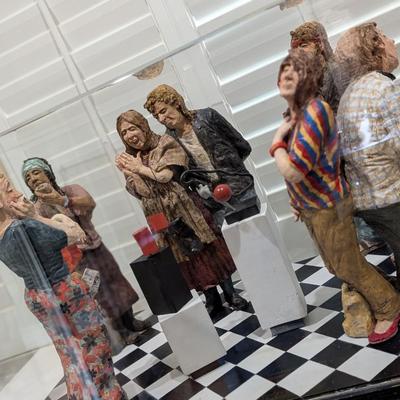 Hand Carved Figurine Art Spectator Scene