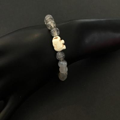 Stoned beaded stretch bracelet with carved elephant