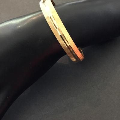 Vintage Monet, gold tone, bangle bracelet with diamond cut and brushed textures