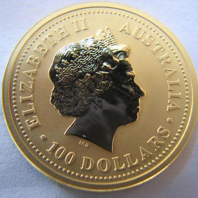 Sale Photo Thumbnail #19: This 2001 gold 1-oz coin from the Perth Mint features the Australian Lunar Series I design for the Year of the Snake.
 
 
The coin is in BU (Brilliant Uncirculated) condition.  It's one troy ounce of pure gold and has a proof-like strike type.  It is what