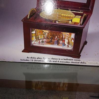 ANIMATED HOLIDAY SYMPHONY, MUSICAL CAROUSEL AND A SANTA IN A TRAIN