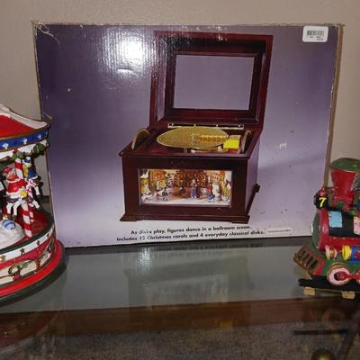 ANIMATED HOLIDAY SYMPHONY, MUSICAL CAROUSEL AND A SANTA IN A TRAIN