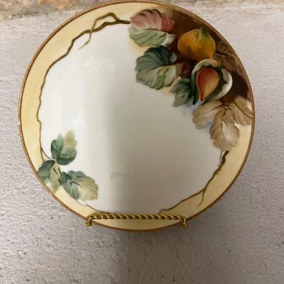 Sale Photo Thumbnail #159: Beautiful acorn relief footed bowl and two different styles of 6 1/2” plates. Small chip on one plate