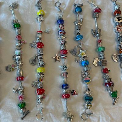 Eleven Charm Bracelets with Glass and Metal Beaded Charms