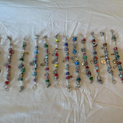 Eleven Charm Bracelets with Glass and Metal Beaded Charms