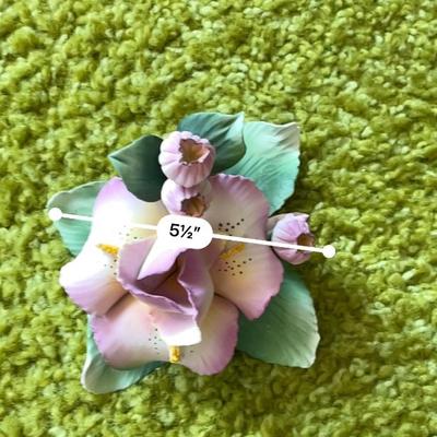 Sale Photo Thumbnail #174: Capodimonte porcelain sculpture featuring a detailed floral design with pink flowers and green leaves. Handmade in Italy by artist Carla Lavatore. Includes the Capodimonte hallmark and original sticker on the underside. Item measures approximately 5.5 inc