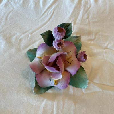 Sale Photo Thumbnail #171: Capodimonte porcelain sculpture featuring a detailed floral design with pink flowers and green leaves. Handmade in Italy by artist Carla Lavatore. Includes the Capodimonte hallmark and original sticker on the underside. Item measures approximately 5.5 inc