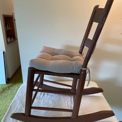 Wooden Ladder-Back Rocking Chair With Woven Seat and Cushion