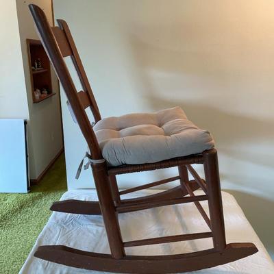 Wooden Ladder-Back Rocking Chair With Woven Seat and Cushion