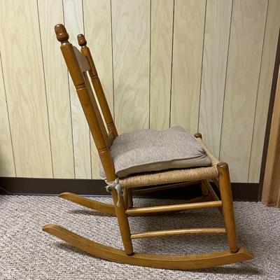 Wooden Rocking Chair with Woven Seat and Beige Cushion