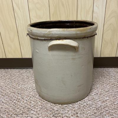Sale Photo Thumbnail #394: 10-gallon capacity stoneware crock featuring two side handles for carrying and a brown glazed interior. Exterior is a light gray color and measures 10'.