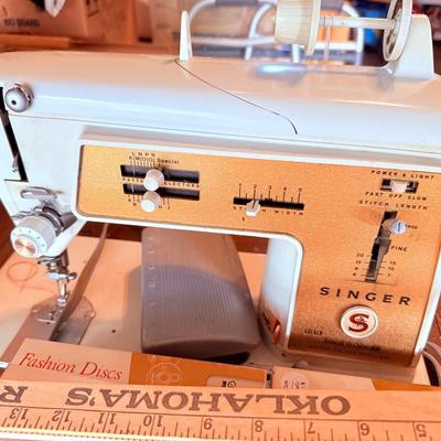 Lot 3: Singer Sewing Machine, Supplies,Tv stand & more