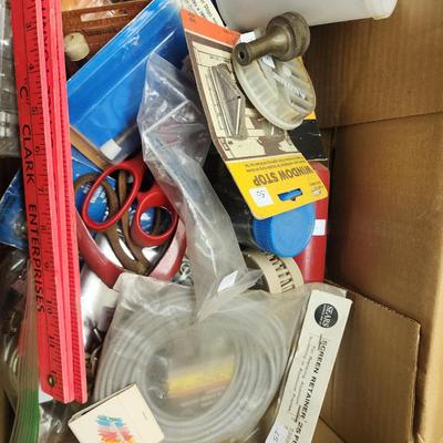 Sale Photo Thumbnail #235: Box of various home repair parts including hand vac, rifle bore cleaner, trowels, Lift-Master garage door remotes, door stops, etc.