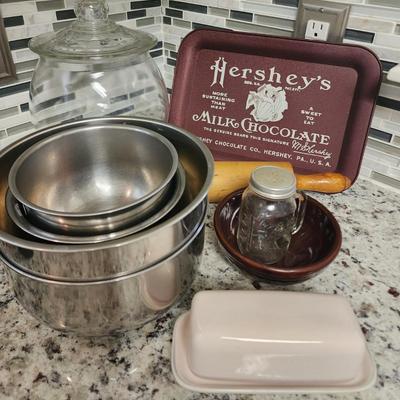 Sale Photo Thumbnail #530: Clear cookie jar, Hershey's tray, 5 stainless steel mixing bowls, clear shaker, brown ceramic bowl, vintage rolling pin & ceramic colored butter dish