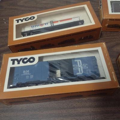 Set of Four Tyco HO Scale Rail Cars Includes Hershey's Box Car, Union 76 Tanker, Hopper and Boston and Maine Box Car
