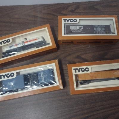 Set of Four Tyco HO Scale Rail Cars Includes Hershey's Box Car, Union 76 Tanker, Hopper and Boston and Maine Box Car