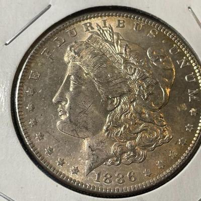 1886-P UNCIRCULATED TONED CONDITION MORGAN SILVER DOLLAR (COIN #4).