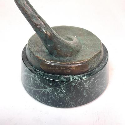 Sale Photo Thumbnail #98: Made out of bronze and polychrome.Hornbill depicted with an egg in its beak, its talons gripping a curved branch; on black round stepped plinth base.  
Measurements:
Bird is 14.5" height, 6.5" diameter for base, total height is 28" height
Valued @ $2500.0