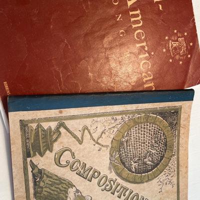 Wood box with composition notebooks and paper weight