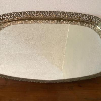 Floral items and gold mirrored tray