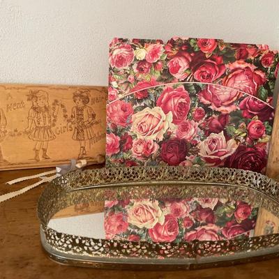 Floral items and gold mirrored tray