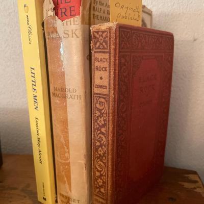 Books, game, bird candleholders and quills