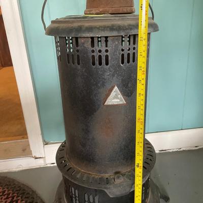 Vintage kerosene heater with iron on top