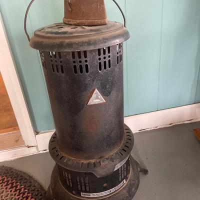 Vintage kerosene heater with iron on top