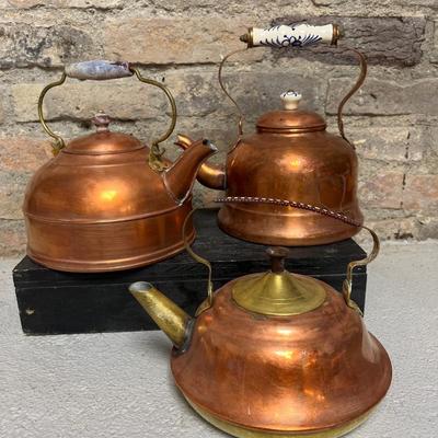 Sale Photo Thumbnail #226: Vintage copper pot with porcelain handle and lid knob, copper and brass teapot , and wooden-handled teapot - who got the Goonies reference???? :)
