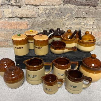 Sale Photo Thumbnail #263: Set of 4 measuring pitchers, lug, lidded pot, trio of condiment pots, two mustard pot duos, and set of salt & pepper shakers