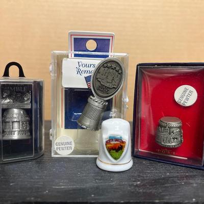 Sale Photo Thumbnail #290: Commemorative thimbles, including Medora, and many other small pewter figures