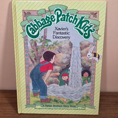 LOT 98F: Vintage Cabbage Patch, Matador & Cheerleader Dolls, With Outfits, Accessories & Hard Cover Cabbage Patch Book...