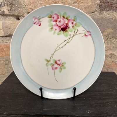 Sale Photo Thumbnail #304: Two handled footed bonbon with roses, single handled tidbit, two 7 3/4” plates and three beautiful 6 1/2” plates, all hand panted