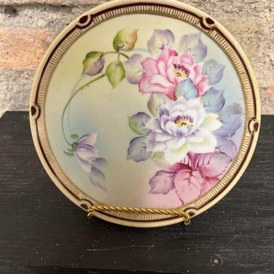 Sale Photo Thumbnail #310: Two handled footed bonbon with roses, single handled tidbit, two 7 3/4” plates and three beautiful 6 1/2” plates, all hand panted