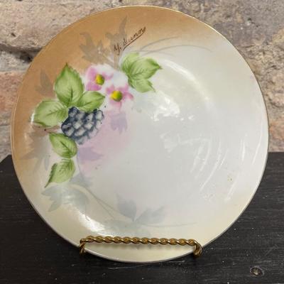 Sale Photo Thumbnail #307: Two handled footed bonbon with roses, single handled tidbit, two 7 3/4” plates and three beautiful 6 1/2” plates, all hand panted