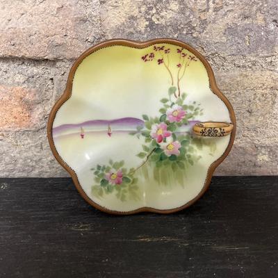 Sale Photo Thumbnail #302: Two handled footed bonbon with roses, single handled tidbit, two 7 3/4” plates and three beautiful 6 1/2” plates, all hand panted